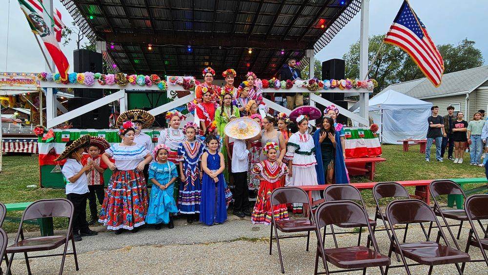 La Fiesta Dance Troupe group photo on the main stage